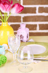Beautiful spring table setting on bright background