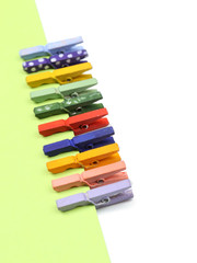 Fototapeta premium Abstract background with colorful wooden pins and paper