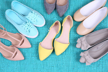 Female fashion shoes on blue carpet