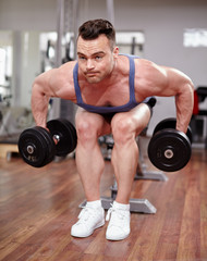 Plakat Man working with dumbbells