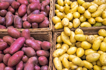 Different potatoes for sale seen at a market