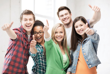 students showing thumbs up at school