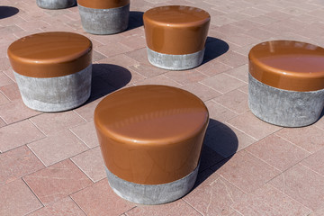 Modern circular stone seats at a Dutch square