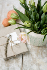 Bouquet of delicate pink tulips on a wooden background