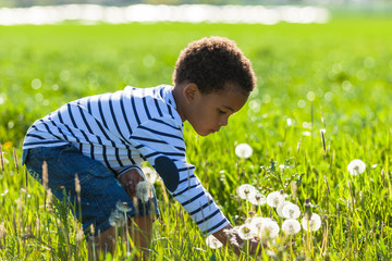Cute african american little boy playing outdoor - Black people © Samuel B.