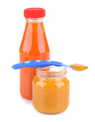 Baby food with carrot isolated on white