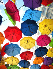 A lot of multicolored umbrellas over the sky