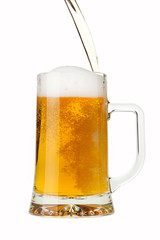 Pouring a pint of sparkling beer isolated on white background