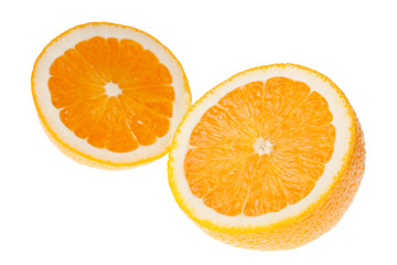 Two halves of orange fruit slightly overlapping