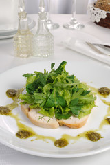 Slices of roasted chicken with lettuce