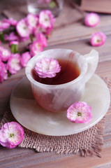 Beautiful fruit blossom with cup of tea