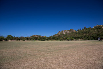 The sloping field at the foot of the mountain