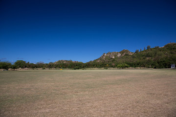 The sloping field at the foot of the mountain