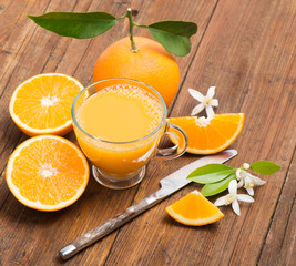freshly pressed orange juice and slices of fruits