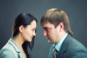 Two young business people talking and discussing