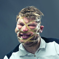 Freak man with rubber on his face