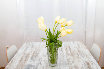 Tulips on a glass pot.