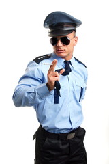 Policeman in sunglasses poses with cigarette on white background