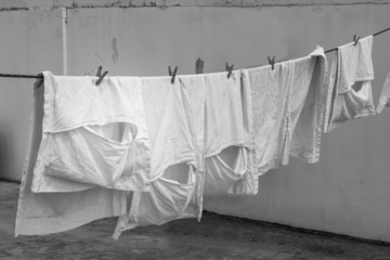 Image Monochrome clothes white  hanging to dry on a laundry line