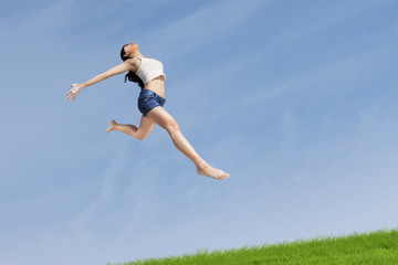 Excited woman jumping highly