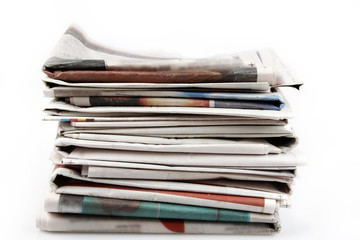 Pile of newspapers isolated on white 