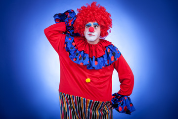Surprised clown men on blue background