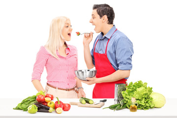 Man and woman enjoy cooking together