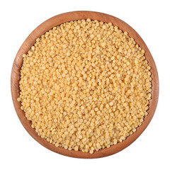 Couscous in a wooden bowl on a white