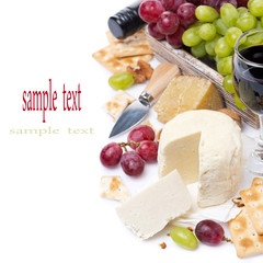 assortment of cheeses, red and green grapes, crackers and wine