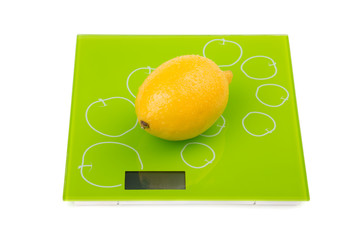Yellow lemon on square scales