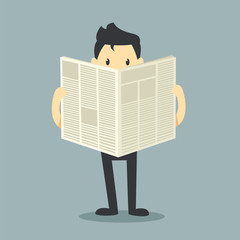 businessman reading a newspaper