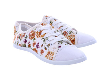 Retro sneakers with a flower pattern on a white background - obrazy, fototapety, plakaty