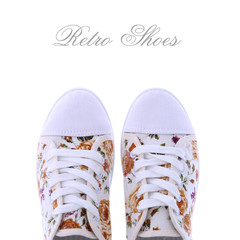 Retro sneakers with a flower pattern on a white background - obrazy, fototapety, plakaty