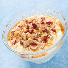 yogurt with muesli, honey, berries, closeup