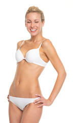 Fototapeta premium Portrait of happy young woman in lingerie