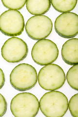 Freshly sliced cucumber  isolated on white background