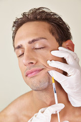 Man getting syringe against wrinkles