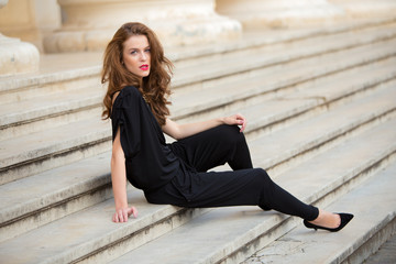 Fashionable woman in backless jumpsuit