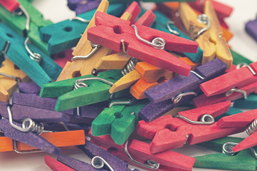 Colorful plastic clothespins in a pile