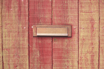 Letterbox and wooden door