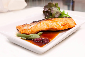 Grilled salmon with teriyaki sauce on the table