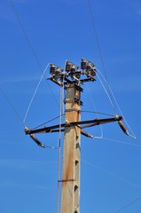 Power pole with external electric separator on top