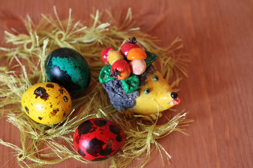 Beautiful easter souvenir, hedgehog and bright eggs