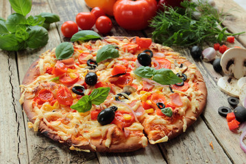Pizza with ham and olives