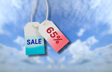 Sale price tag with cloud and blue sky background