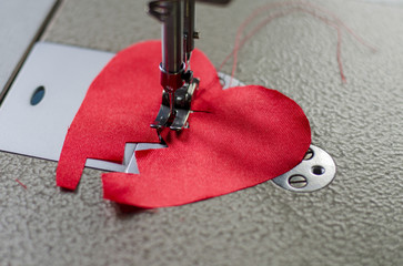 stitched red cloth broken heart