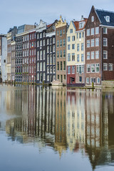 Fototapeta premium The Damrak canal in Amsterdam, Netherlands.