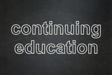 Obraz premium Education concept: Continuing Education on chalkboard background