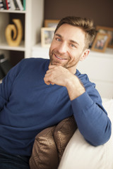 Fototapeta premium Portrait of handsome man on sofa