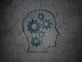 Data concept: Head With Gears on grunge wall background